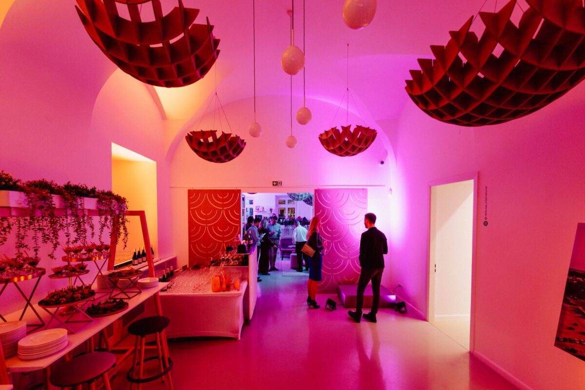 Interior of the Narbutas showroom in pink event lighting